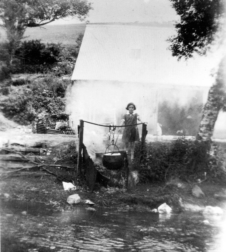 70 Girl Cooking by the river