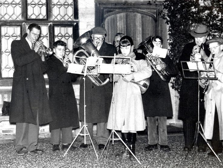 Handcross band playing carols