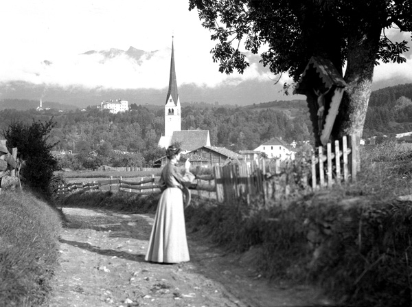 Woman at roadside shrine- Germany