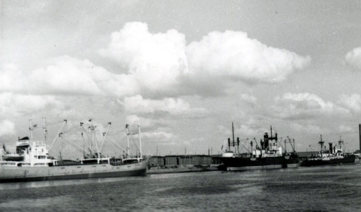 1950s Cargo vessels berthed at harbour